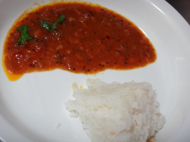 Vengaya Vethalkuzhambu served with rice. 