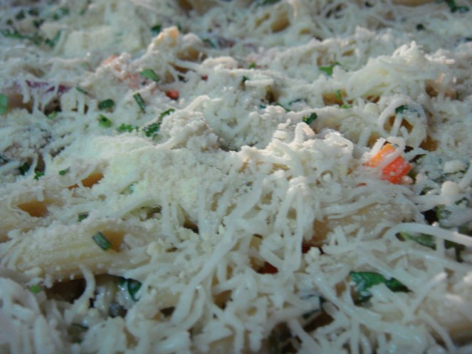 Mozzarella Cheese sprinkled over the pasta before baking. 