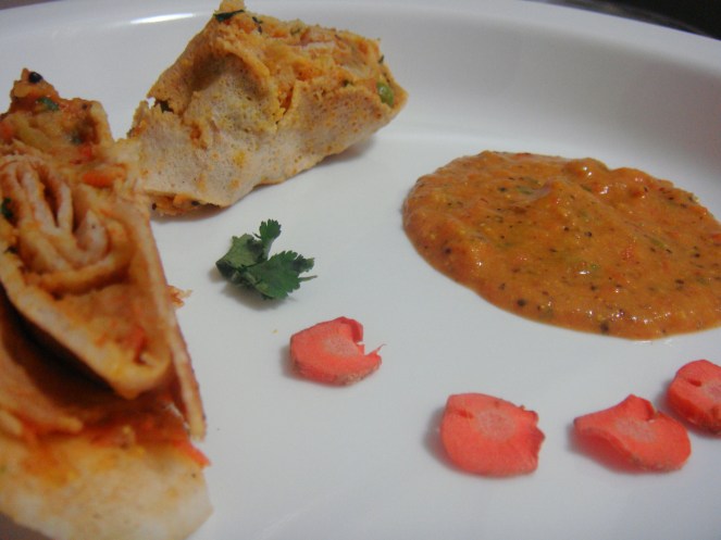 Colourful Stuffed Dosa Rolls served with Tomato Carrot Chutney.