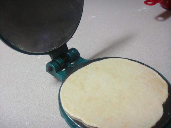 Poori making in the Poori Press.