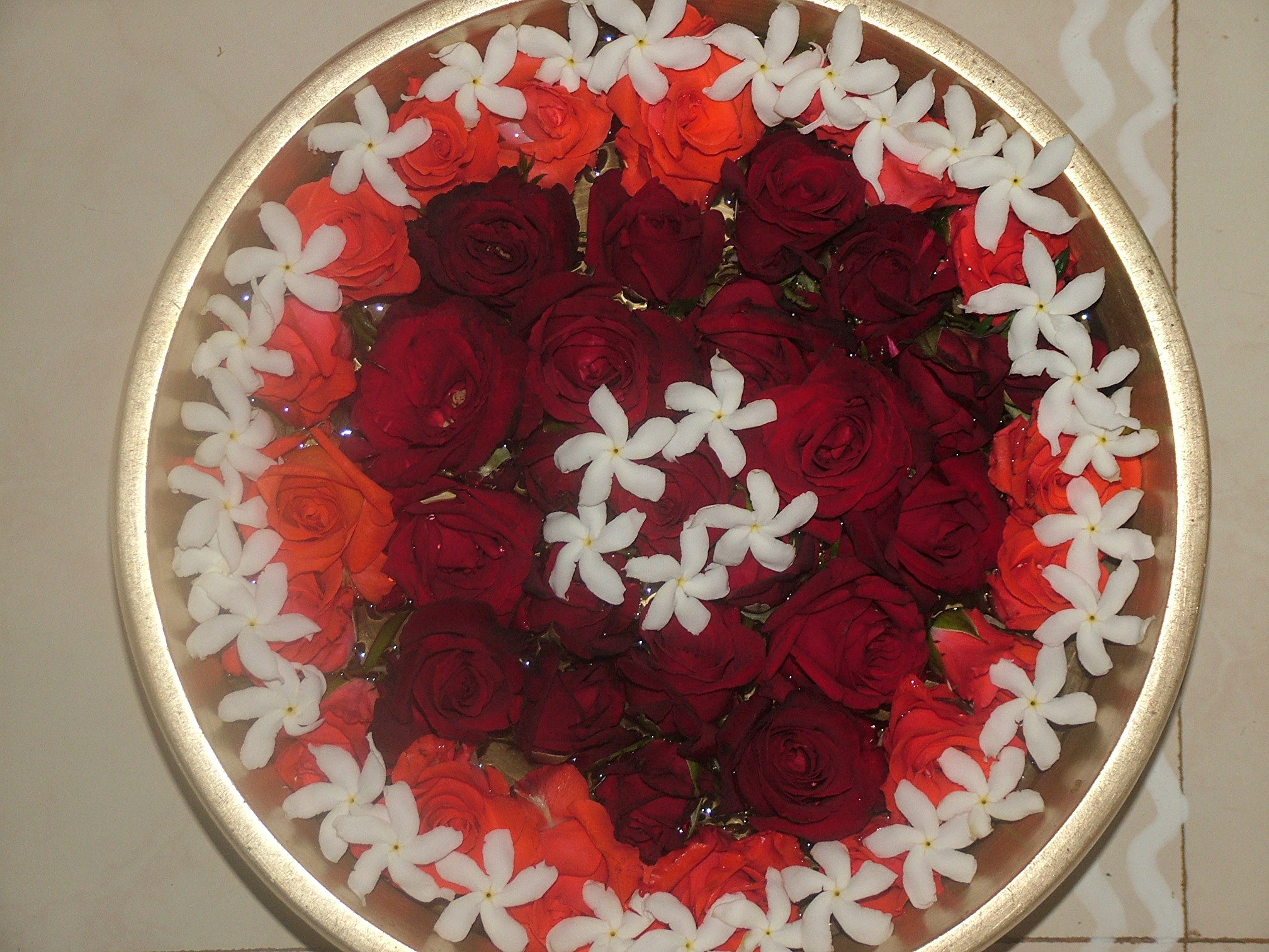 Maduraiamma`s Uruli with flowers. 